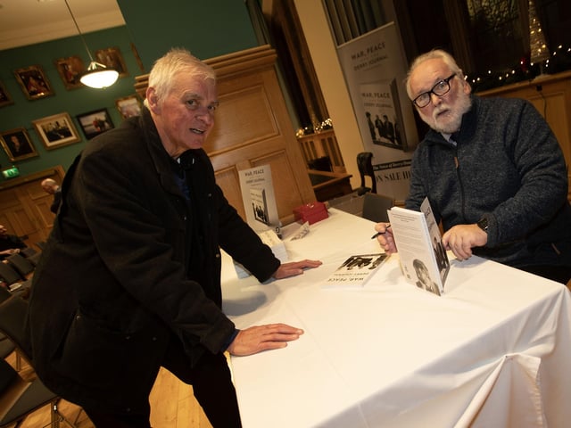 Local priest Fr. Michael Canny, one of the first at Thursday night's 'War, Peace and the Derry Journal' book signing, pictured with Pat McArt, author. (Photos: Jim McCafferty Photography)
