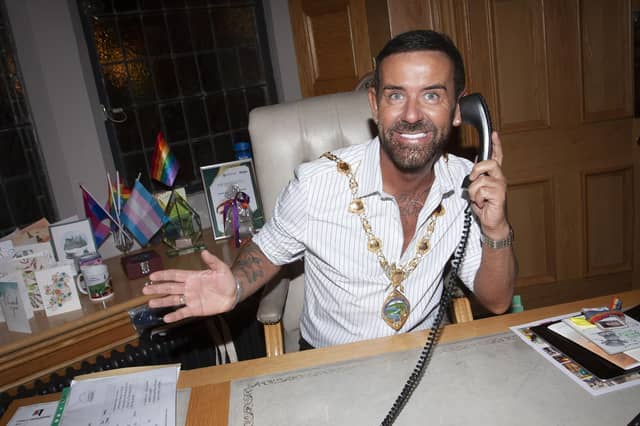Micky gets to try out the Mayor’s chair in the parlour on Thursday evening.