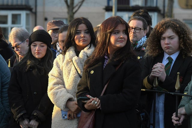 People gathered at the Bloody Sunday monument at Joseph’s Place on Tuesday afternoon for a one minute silence on the 52nd anniversary of the Bloody Sunday massacre. Photo: George Sweeney.