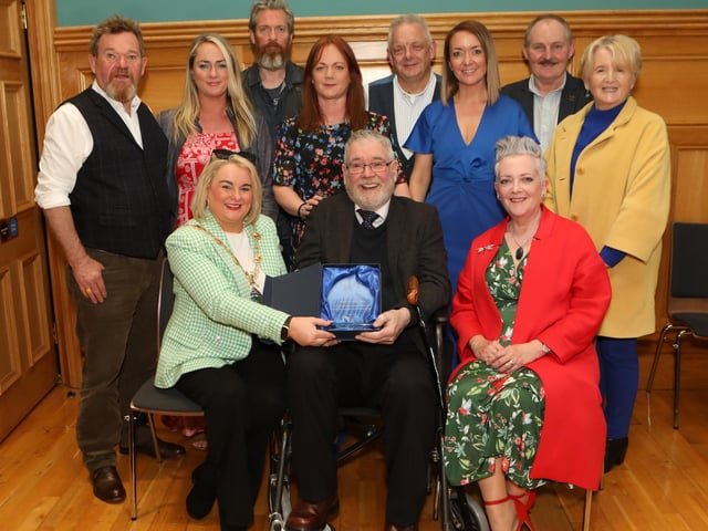 Mayor Sandra Duffy making a presentation to sculptor Maurice Harron, in recognition of his contribution as an art educator and artist in the City and District at a civic reception held in the Guildhall. Included are family and friends. (Photo - Tom Heaney, nwpresspics)