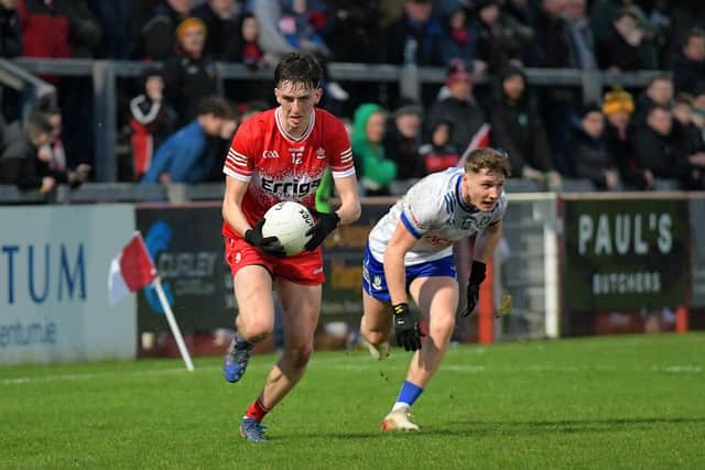 Derry’s Paul Cassidy evades a tackle from Monaghan’s Michael Hamill. Photo: George Sweeney