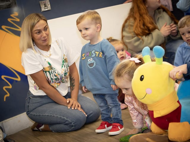 This young toddler and his mum engrossed by the storytelling on Thursday.