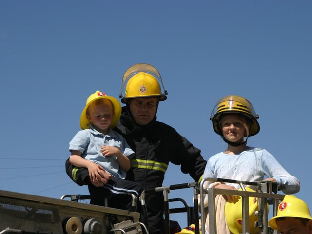 Out in the summer, on top of the Fire Engine.