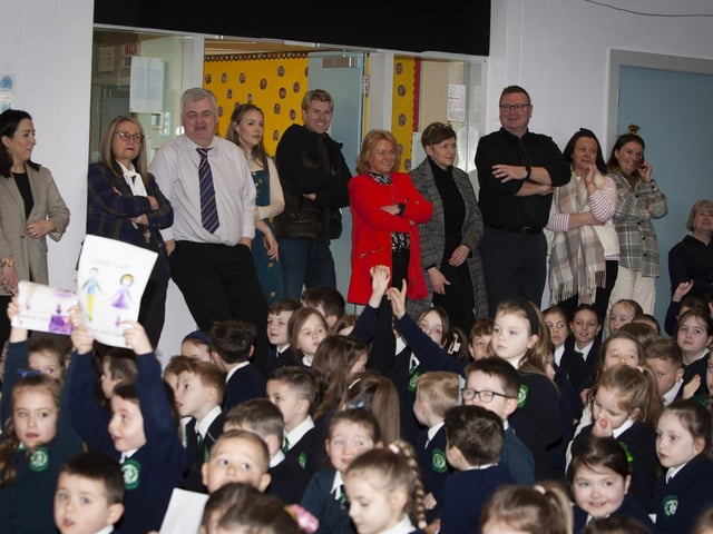 Staff at St Patrick’s PS join in the fun during Damian McGinty’s visit to the school on Tuesday morning.