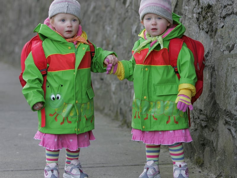 2 yr old twins Louise and Aoife Gallanagh kept wrapped up during St. Patrick's Day parade in Buncrana. (1903JB11) : St Patrick's Day in Buncrana in 2006