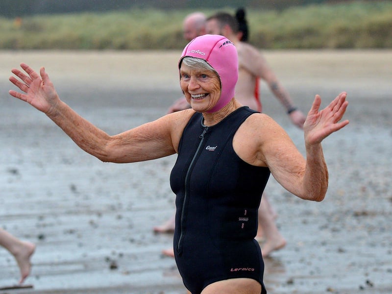 A swimmer makes her way to the sea during the annual Christmas morning charity swim at Ludden beach. Photo: George Sweeney. DER2252GS – 12