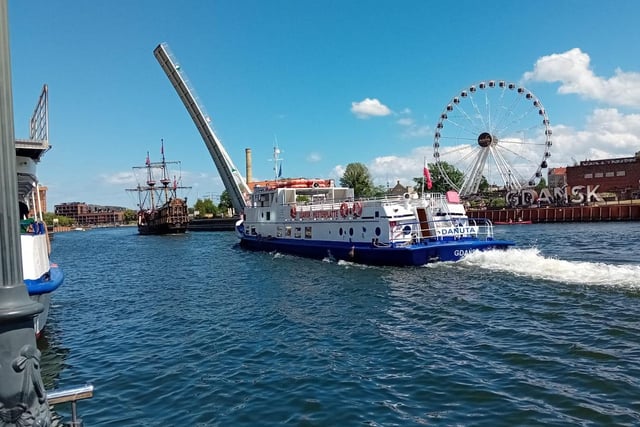 Pleasure boats make their way along the Motlawa in the centre of Gdansk.