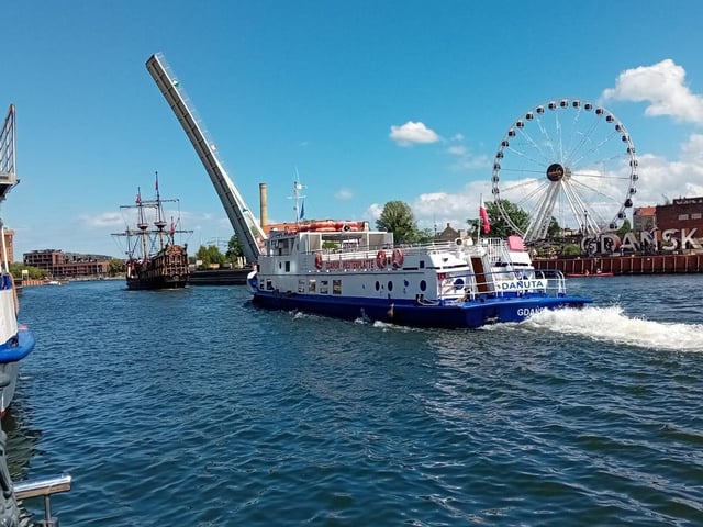 Pleasure boats make their way along the Motlawa in the centre of Gdansk.