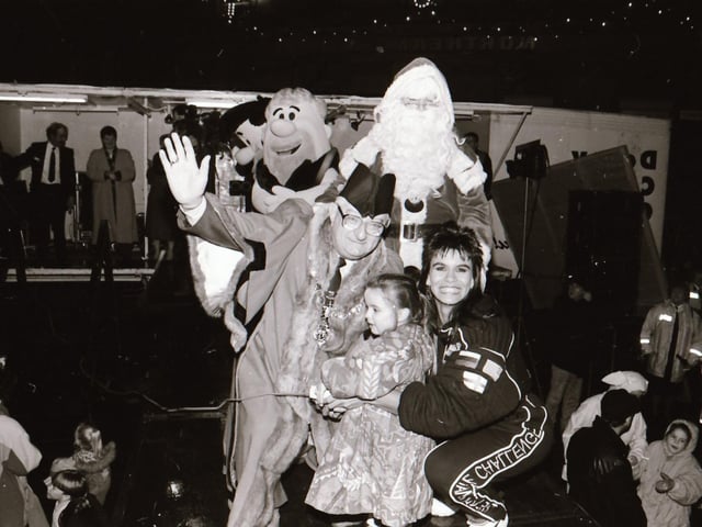 Santa, with help from TV Gladiator Falcon, also known as Bernadette Hunt, switched on the Derry Christmas lights.