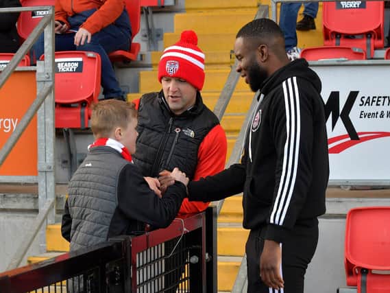 Former Derry City striker James Akintunde chats with fans at the Brandywell. Photo: George Sweeney. DER2315GS – 114