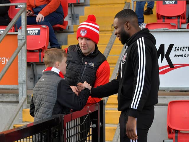 Former Derry City striker James Akintunde chats with fans at the Brandywell. Photo: George Sweeney.  DER2315GS – 114