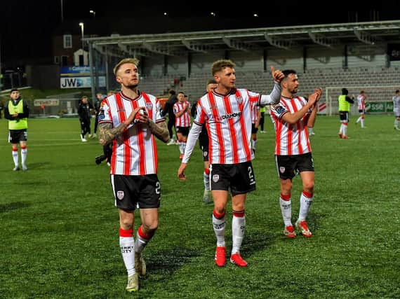 Derry City's Carl Winchester, Ronan Boyce and Michael Duffy salute fans.