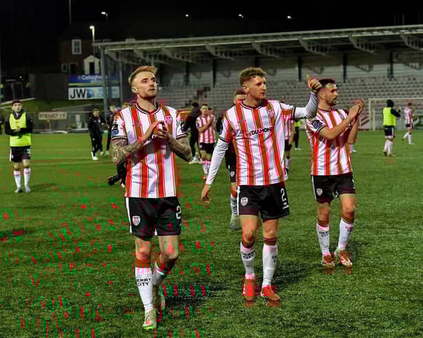 Derry City's Carl Winchester, Ronan Boyce and Michael Duffy salute fans.