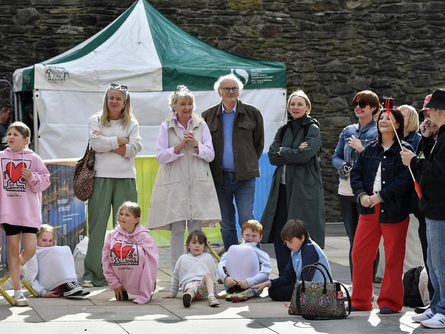 Revellers enjoy the sunshine and the music in Guildhall Square during the Jazz Festival.  Photo: George Sweeney