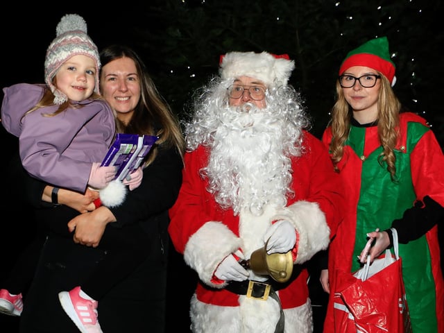 Chloe and Aooibhe Thompson with Santa and his elf. (Photo - Tom Heaney, nwpresspics)