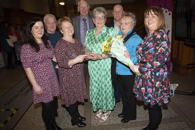Strabane woman Ursula Melaugh pictured with members of the O’Kane family during Tuesday’s reception in the Guildhall, Derry on Tuesday evening when she received an award from the Mayor, Sandra Duffy. Ursula looked after and cared for the O’Kane family’s late mother Eileen. Included back centre is Ursula’s husband Joe.