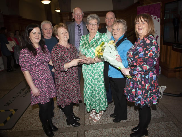 Strabane woman Ursula Melaugh pictured with members of the O’Kane family during Tuesday’s reception in the Guildhall, Derry on Tuesday evening when she received an award from the Mayor, Sandra Duffy. Ursula looked after and cared for the O’Kane family’s late mother Eileen. Included back centre is Ursula’s husband Joe.