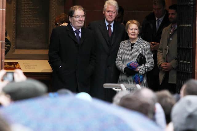 Former American President Bill Clinton pictured previously part in a one day visit to Northern Ireland to help launch a new book on peacemaking on behalf of the University of Ulster.  Mr Clinton started his visit by walking over the Peace Bridge in Derry followed by a reception and speech at the Guildhall. Bill Clinton in front of the Guildhall with former SDLP leader John Hume and his wife Pat. Kelvin Boyes   / Press Eye.