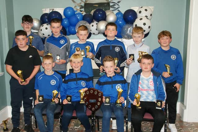 The Under 13 Boys B team with their trophies at the Quigley Points Swifts 50th Anniversary Dinner Dance and Presentation evening.