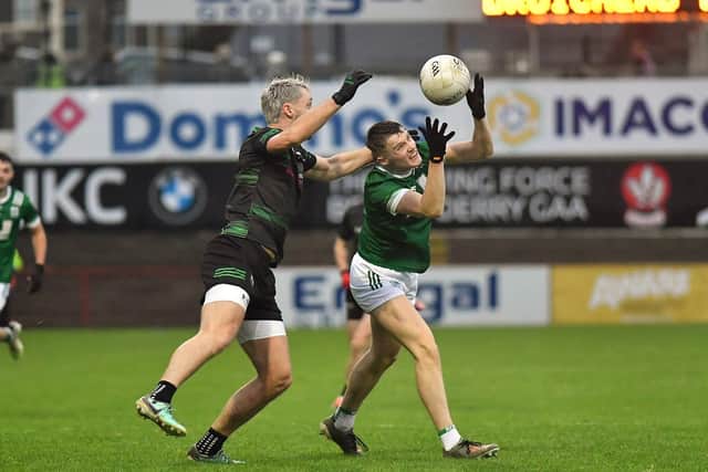 Newbridge's Patrick McMullan gets  the ball ahead of Glen's Ryan Dougan. Photo: George Sweeney