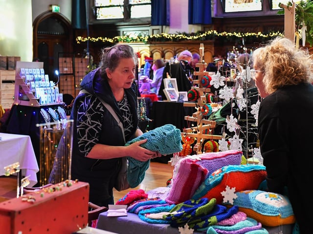 Browsing the large range of gifts availableat the Guildhall Christmas Fair. Photo: George Sweeney / Derry Journal