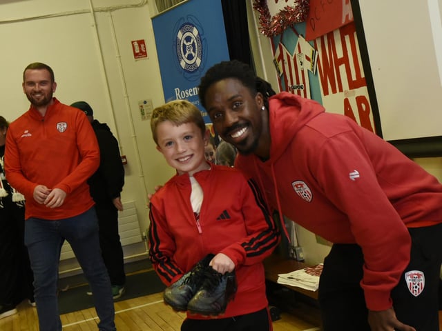 Tiarnan, winner of the signed football boots.