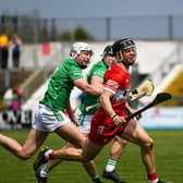 Derry’s Corey O’Reilly and London’s  Cathal O’Carroll contest a loose sliothar. Photo: George Sweeney