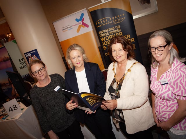 JOINT STALLS. . . .Mayor Patricia Logue at the Labour Market Partnership and Cross Border Partnership Employment Services stall with, from left, Nicky Gilleece, Lorraine O'Malley and Emma Quinn at Tuesday's Derry Jobs Fair in the City Hotel.