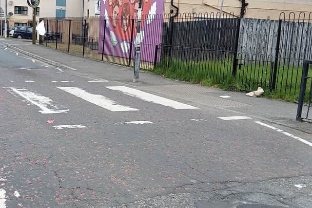 Eroded markings at one of the pedestrian crossings.