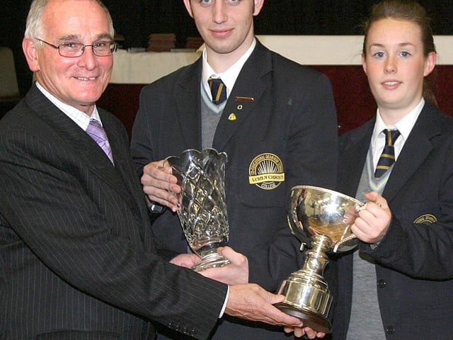 Declan O' Kelly, guest speaker at Lumen Christi College annual Prizegiving ceremony presenting 'Pupil of the Year' awards to Stephen McLaughlin (year 13) and Katie Henderson (Year 11). (1411T03).:Lumen Christi College prizegiving ceremony in 2003