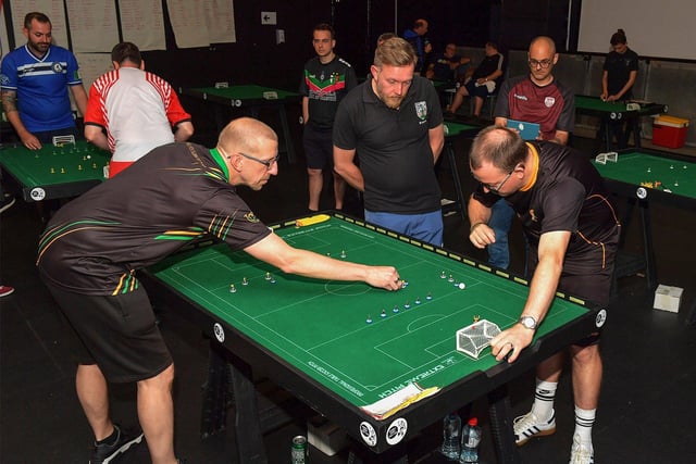 Competitors consider their options during the Subbuteo Irish Open held in the Nerve Centre. Photo: George Sweeney. DER2325GS - 116
