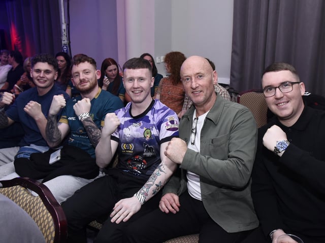 Rathmor Warriors Kickboxing Gym members including Conal McBrearty and coach Sean McGill watch the action at the Everglades.