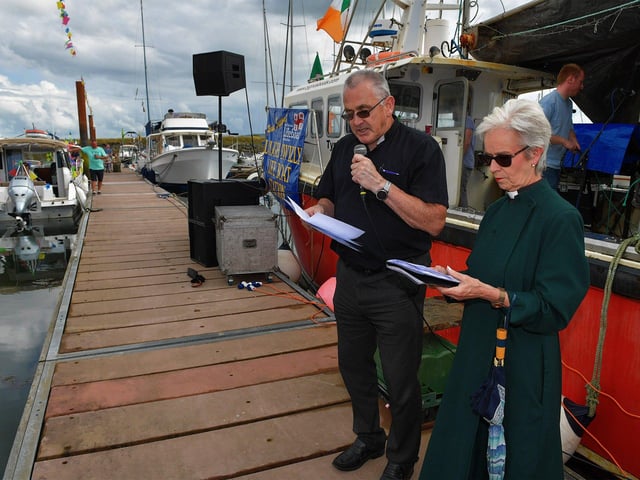 Fr Paddy Baker alongside the Rev. Canon Judi Gaffin at the blessing of the boats at the Fahan Marina on Sunday afternoon. Photo: George Sweeney. DER2326GS - 07