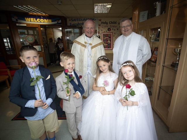 Bishop Donal McKeown and Fr. McFaul pictured with some of the First Holy Communion pupils - Daniel, Jake, Lailagh and Clara Lee before Thursday's procession to St. Mary's Church, Creggan. (Photos: Jim McCafferty Photography)
