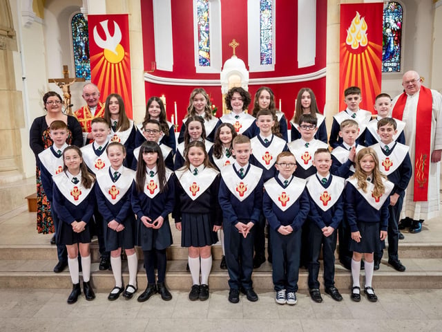 Pupils from Miss R Doherty's Class, St Patrick's Primary School, pictured at their confirmation at St Patrick's Chapel, Pennyburn. Included, are Fr Noel McDermott, and Fr Michael McCaughey. (Stephen Latimer)