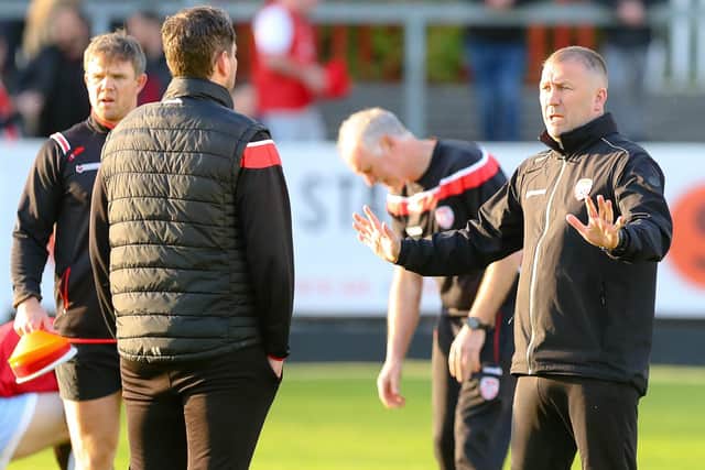 Derry City assistant manager Alan Reynolds talks with boss Ruaidhrí Higgins earlier in the season at Richmond Park.