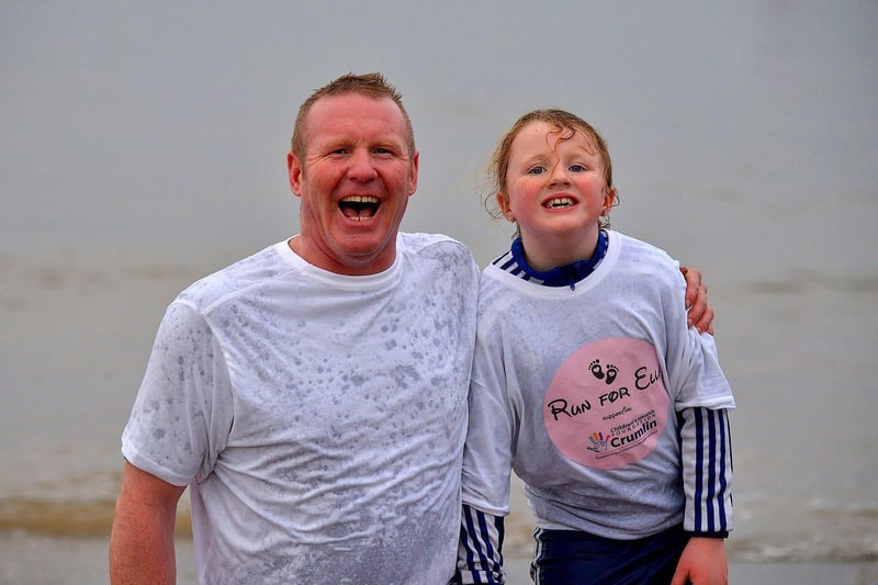 Hugh (QP) and Elle Henderson from Buncrana took part the annual Christmas morning charity swim at Ludden beach. Photo: George Sweeney. DER2252GS – 30