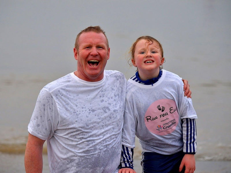 Hugh (QP) and Elle Henderson from Buncrana took part the annual Christmas morning charity swim at Ludden beach. Photo: George Sweeney. DER2252GS – 30