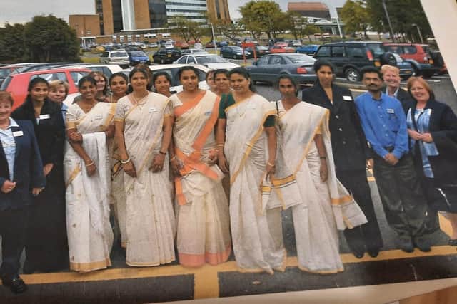 The nurses, left to right Jisha, Annie, Asha, Benacy, Bindhu, Annamarra, Baby Jose, Sicily, Bency, Lincey and Hemaint, are greeted by Altnagelvin Hospital staff on arrival back in May 2003. Absent from the picture is fellow newly arrived nurse Stella.