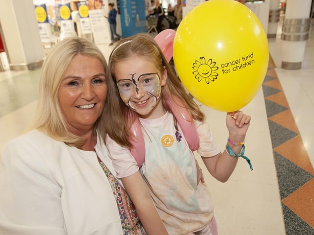 Showing their support for Lisnagelvin Shopping Centre's Annual Great Family Fun Day in aid of charities is seven years-old Eimear Wilson and her grandmother Eileen Breen.