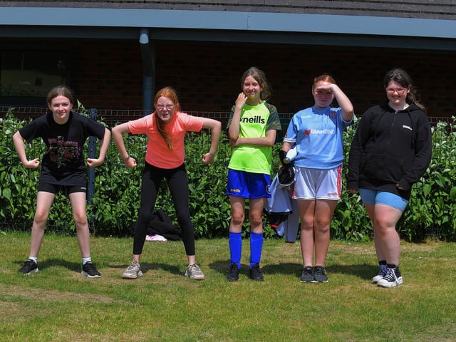 Friends enjoy the sunny weather and games at the Holy Child Primary School sports day held on Monday last. Photo: George Sweeney. DER2325GS – 011