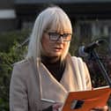 Ciara Devlin reads a poem written by her son Eoghan McKinney at the Bloody Sunday monument, at Joseph’s Place on Tuesday afternoon, where a one minute silence was observed on the 52nd anniversary of the Bloody Sunday massacre. Photo: George Sweeney.