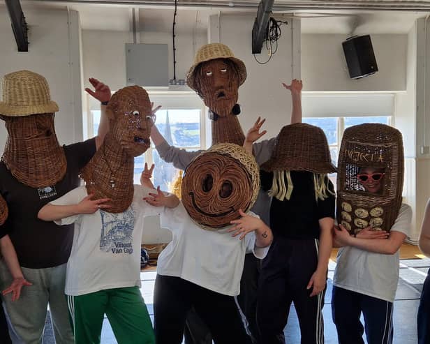 Dancers from the Playhouse with their wicker heads on for the Triumph of Music.