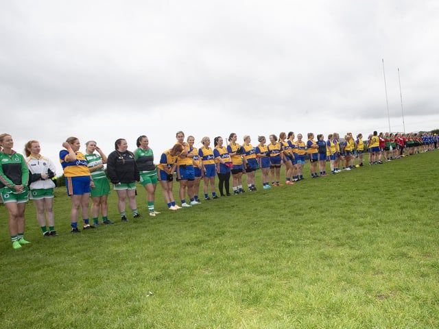 Ladies line up for the National Anthem during Saturday's event at Beart GAC.