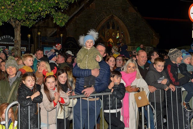 People gather for the switching on of the Christmas tree lights in Buncrana on Friday evening last. Photo: George Sweeney. DER2247GS – 99