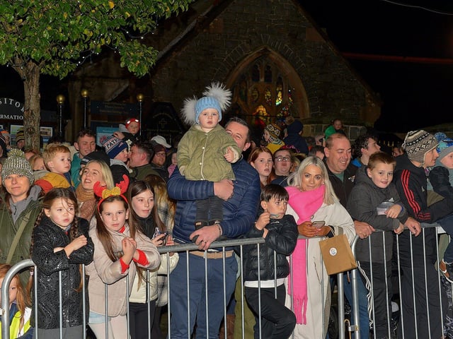 People gather for the switching on of the Christmas tree lights in Buncrana on Friday evening last. Photo: George Sweeney. DER2247GS – 99
