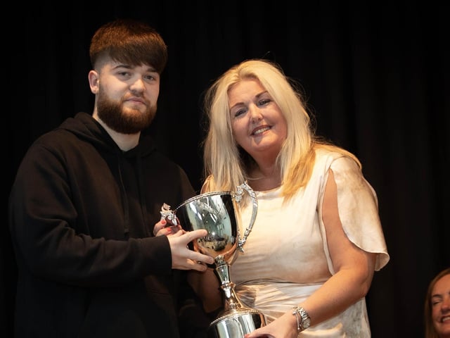 Mrs. Ciara Deane, Principal, presenting the award for Senior Sports Person of he Year to Darren Spencer on Thursday last.