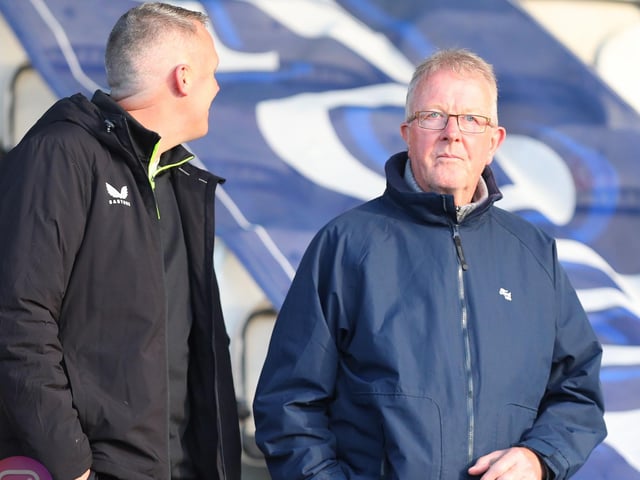 Deep in thought. . . These Derry City fans take in the pre-match build-up at the RSC. Mandatory Credit: Kevin Moore/MCI