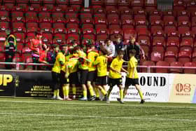 Club Mercedarius players celebrate their second goal against Donegal. Photograph: George Sweeney