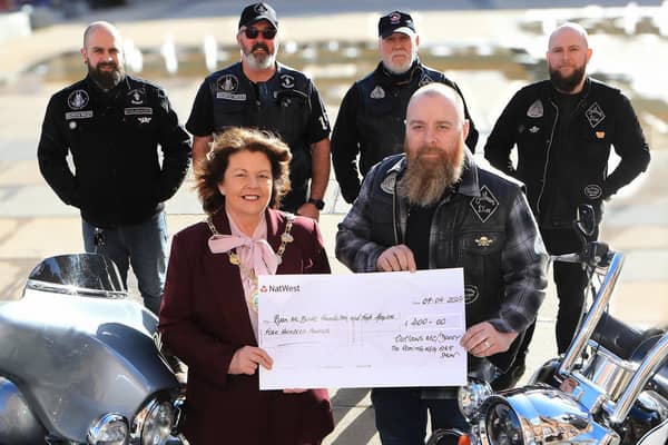 Kevin Kelly handing over a cheque for £400 to Mayor Patricia Louge for the Mayor's Charity, from the Roaring Meg Bikers. Back, from left, are Gary Doherty, Kenny Quigley, William Mulhern and Mickey Kelly. (Photo - Tom Heaney, nwpresspics)